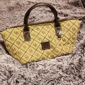 Dooney & Bourke brown canvas bag with handles.